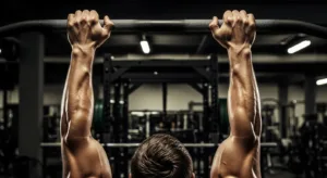Muscular forearms gripping pull-up bar demonstrating proper grip strength for back training exercises
