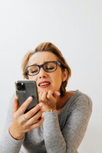This Free Test Reveals Your "Real" Biological Age — And It's Shocking woman looking shocked to her phone